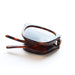 Sunglasses with tortoiseshell frame and reflective lenses on a white background